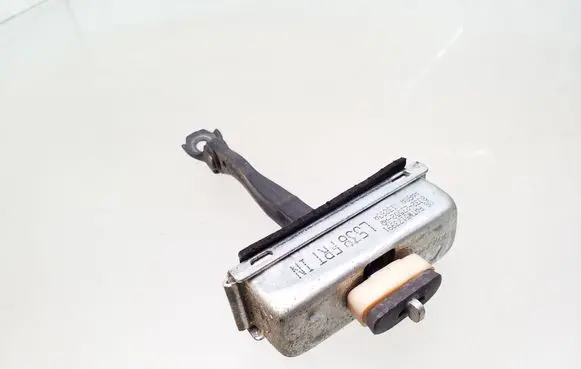 Front door check strap stopper
