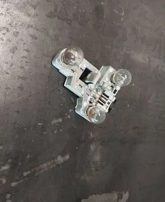 Tail light bulb cover holder