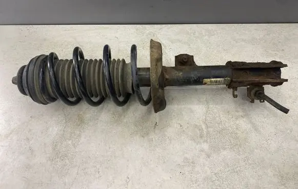 Opel Corsa D Front shock absorber with coil spring 13214353