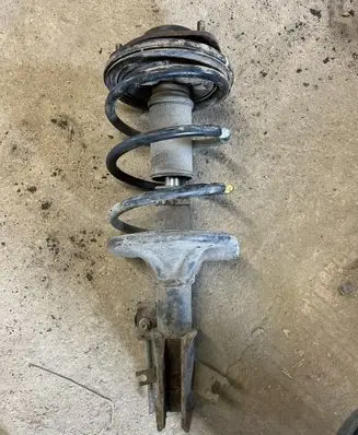 Mitsubishi Carisma Front shock absorber with coil spring