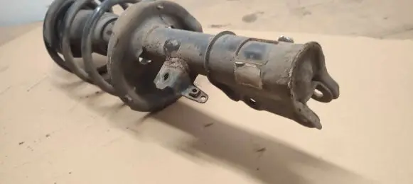 Front shock absorber with coil spring