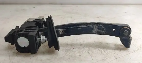 Front door check strap stopper