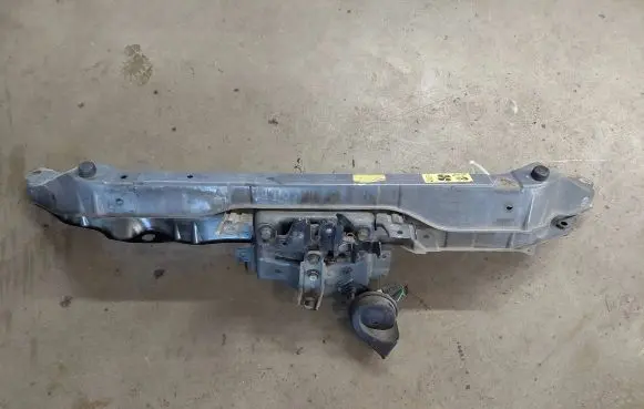 Top upper radiator support slam panel