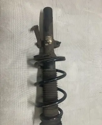 Front shock absorber with coil spring