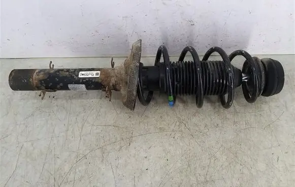 Volkswagen Golf IV Front shock absorber with coil spring 1J0413031S