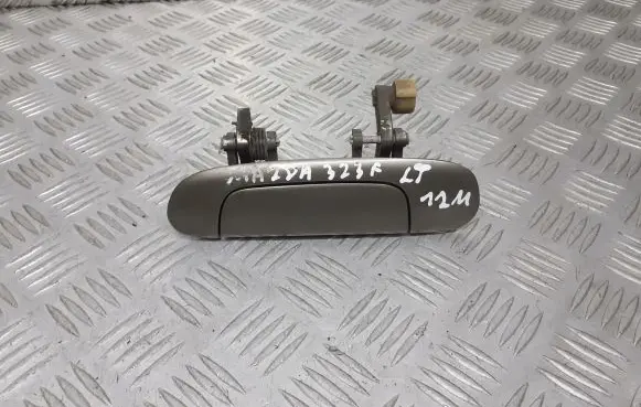 Mazda 323 F Rear door handle trim 