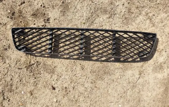 Mazda 323 Front bumper lower grill B30D501T1