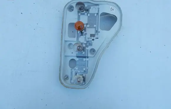 Tail light bulb cover holder