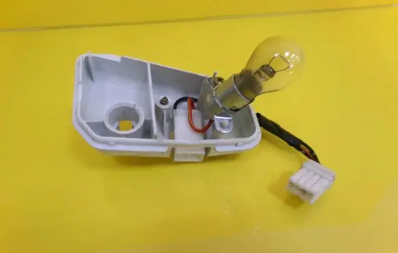 Mazda 626 Tail light bulb cover holder 043-1397