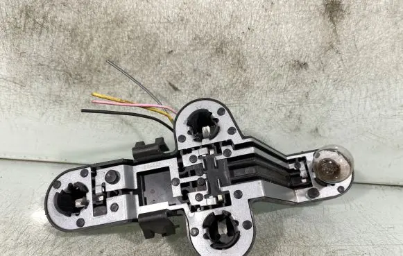 Tail light bulb cover holder