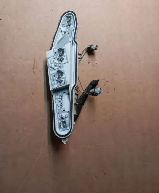 Tail light bulb cover holder