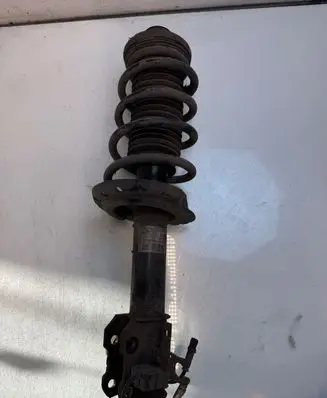 Front shock absorber with coil spring