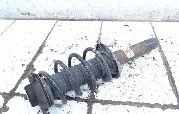 Volkswagen Golf V Front shock absorber with coil spring 1T0413031HA