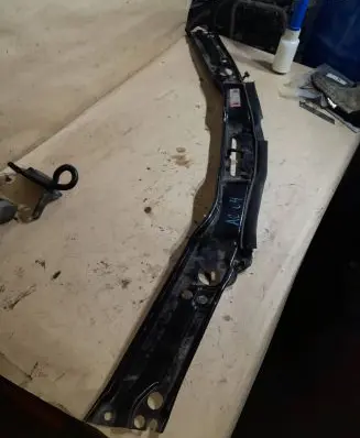 Top upper radiator support slam panel