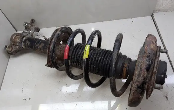Nissan Primera Front shock absorber with coil spring