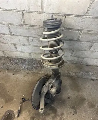 Front wheel hub spindle knuckle