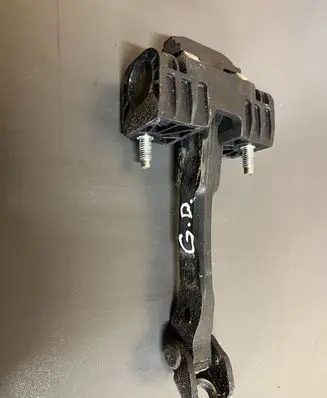 Front door check strap stopper
