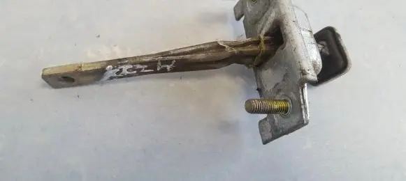 Mazda 323 Rear door check strap stopper