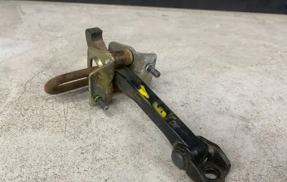 Rear door check strap stopper