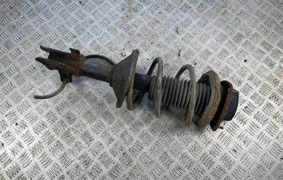 Subaru Impreza I Front shock absorber with coil spring