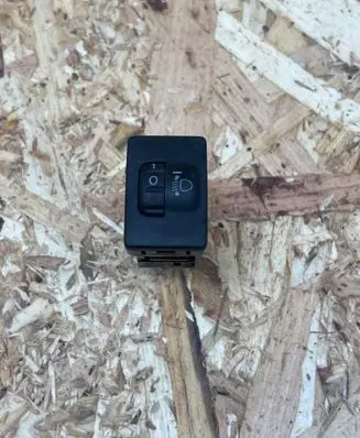 Headlight level height control switch