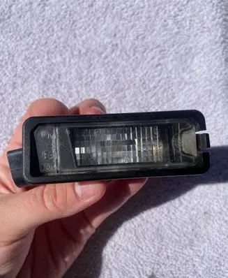 Volkswagen Golf VI Number plate light 1K8943021