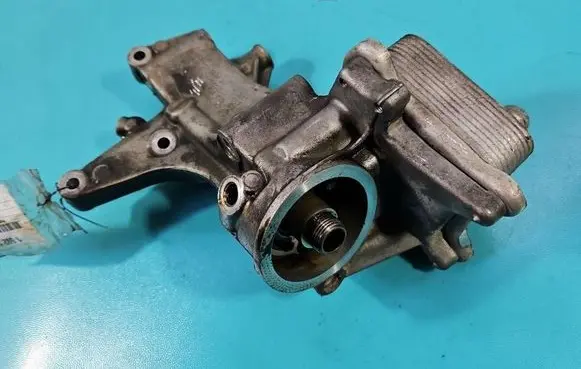 Volkswagen Golf VI Oil filter mounting bracket 03F117021A IMPRK1592157