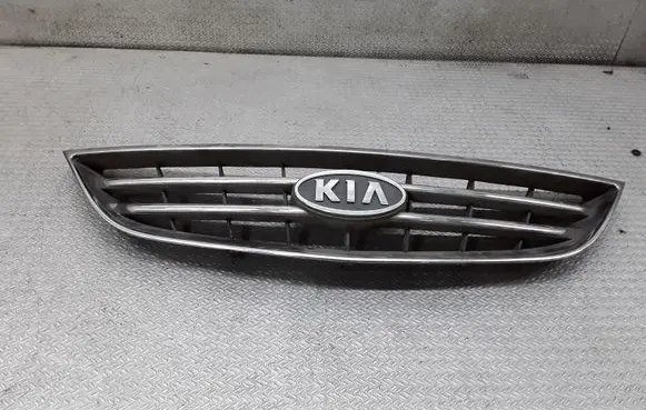 KIA Carens I Front bumper upper radiator grill
