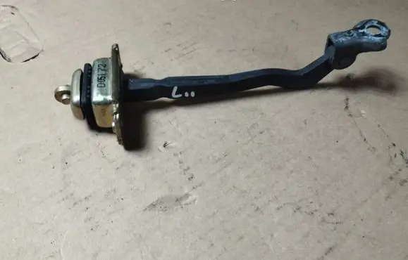 Rear door check strap stopper