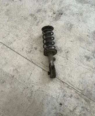 Front shock absorber with coil spring