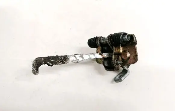 Front door check strap stopper