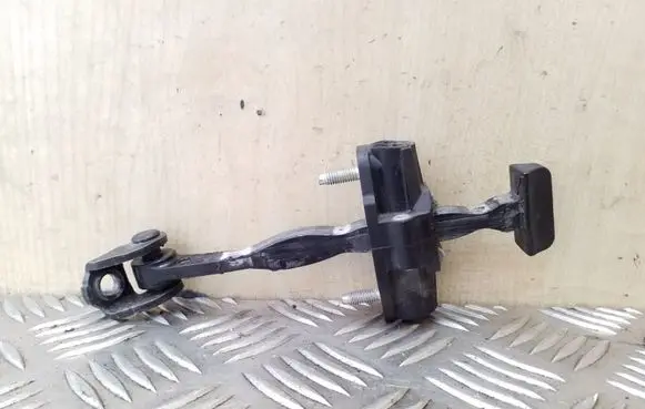Front door check strap stopper