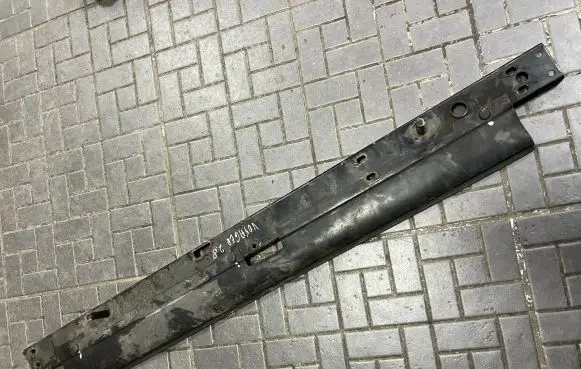 Top upper radiator support slam panel