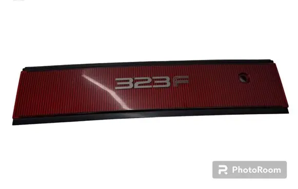 Mazda 323 F Trunk door license plate light bar 0674434