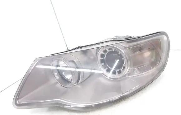 Volkswagen Touareg I Headlight/headlamp 7L6941031A 1LL24703203