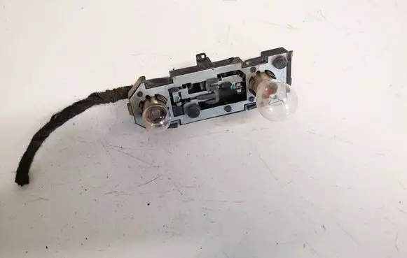 Tail light bulb cover holder