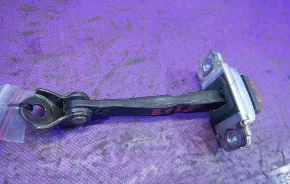 Front door check strap stopper