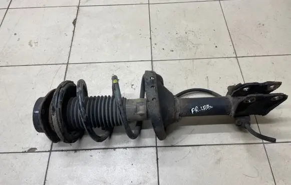 Subaru Outback Front shock absorber with coil spring