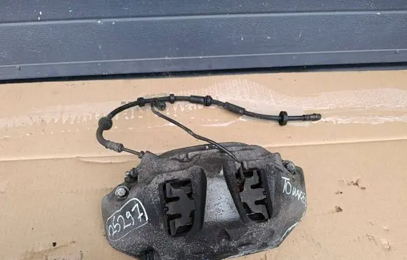 Volkswagen Touareg III Front brake caliper 