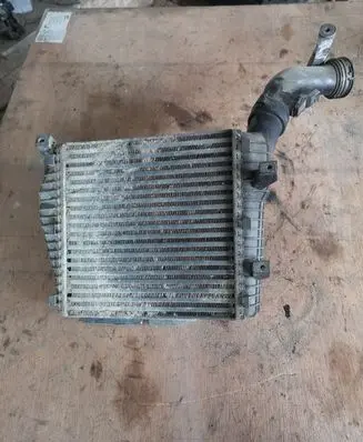 Volkswagen Touareg I Intercooler radiator 7L0145803A