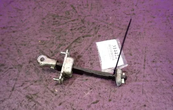 Front door check strap stopper