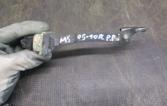 Mazda 5 Front door check strap stopper 