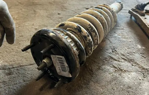 Jaguar XF Front shock absorber with coil spring