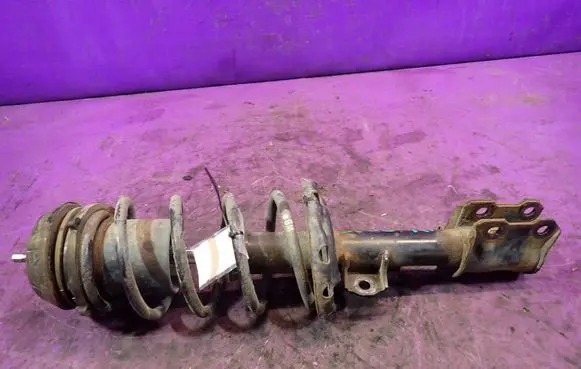 Opel Corsa D Front shock absorber with coil spring 
