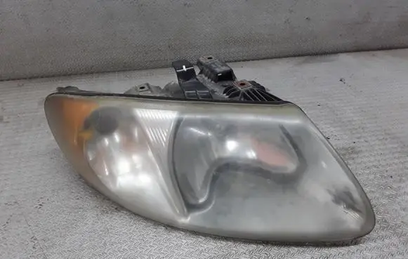Chrysler Town & Country IV Headlight/headlamp 04857700AB