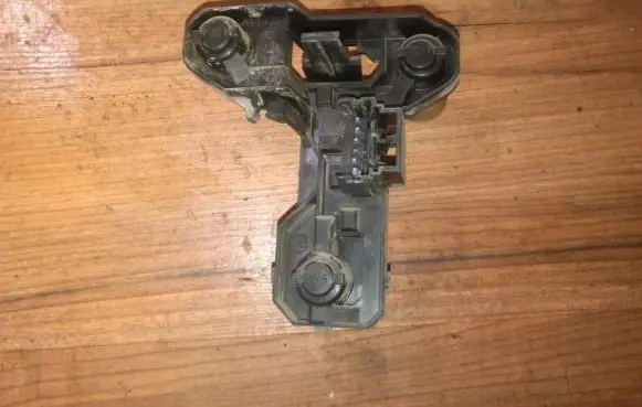 Tail light bulb cover holder
