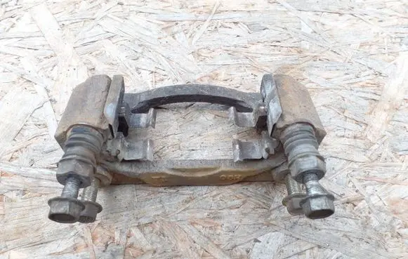 Subaru Legacy Brake caliper pad carrier rear 
