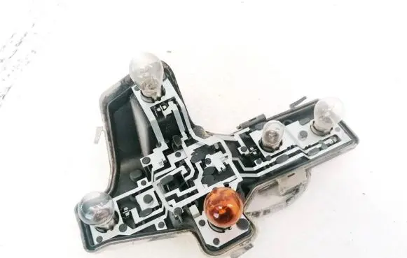 Tail light bulb cover holder