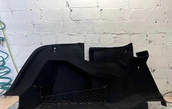Trunk/boot lower side trim panel