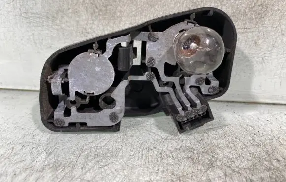 Tail light bulb cover holder